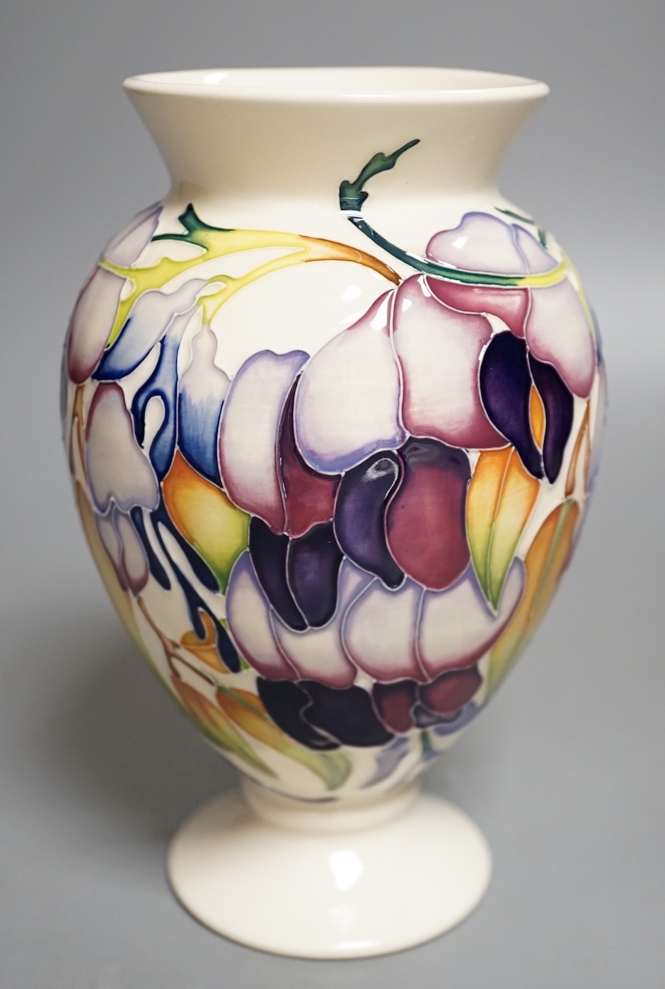 A Moorcroft 'purple wisteria' vase, 2013, 17.5 cms high.